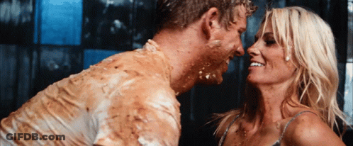 Man Covered In Mud Looking At Woman GIF