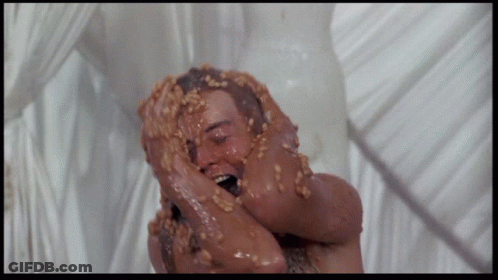 Man Covered In Peanut Butter And Nuts GIF