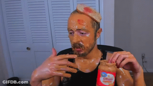 Man Covered In Peanut Butter Holding Jar GIF