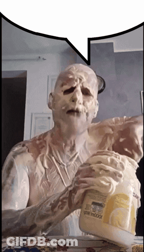 Man Covered In Whipped Cream Holding Indoor Container GIF