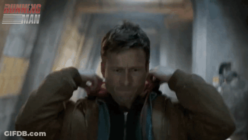 Man Covering Ears Beside Running Sign GIF