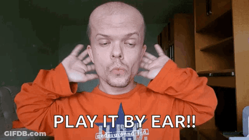 Man Covering Ears Saying Play It By Ear GIF
