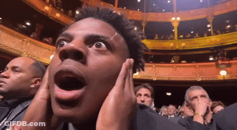 Man Covering Ears While Watching Show GIF