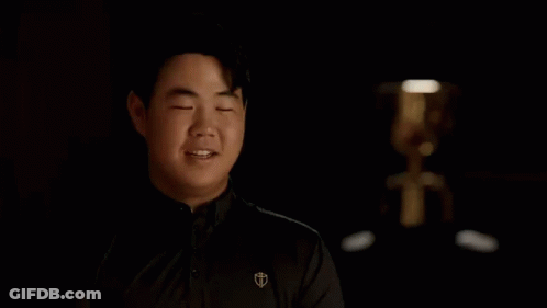 Man Covering Eyes In Dark Room GIF