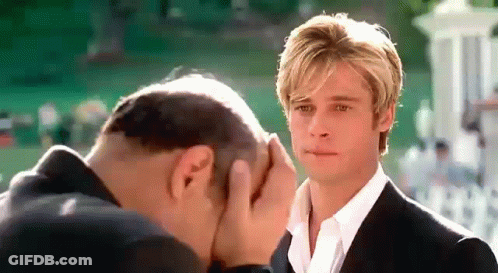 Man Covering Face As Another Looks On GIF