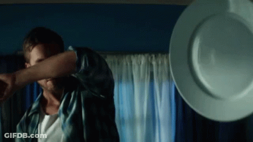 Man Covering Face As Plate Thrown GIF
