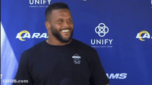 Man Covering Face At LA Rams Banner GIF