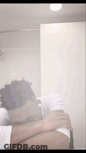 Man Covering Face In Bathroom GIF