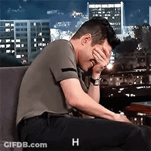 Man Covering Face In Chair GIF