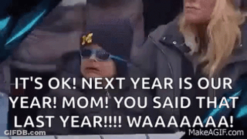 Man Covering Face In Front Of NY Giants Ad GIF