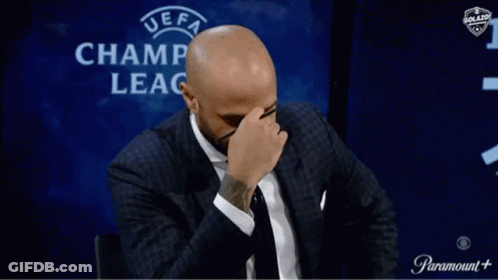Man Covering Face In Front Of UEFA Champ Leag GIF