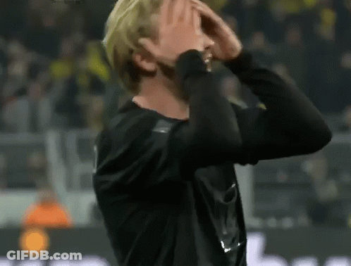 Man Covering Face On Soccer Field GIF