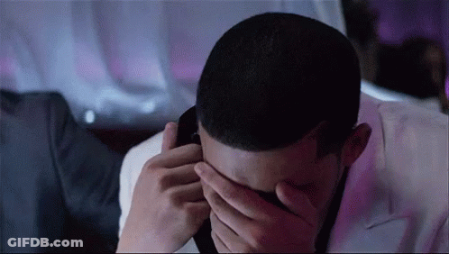 Man Covering Face Talking On Phone GIF