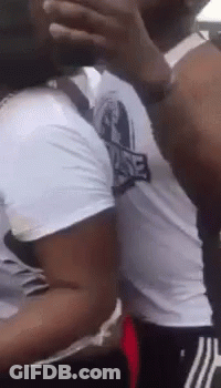 Man Covering Face While Another Looks On GIF