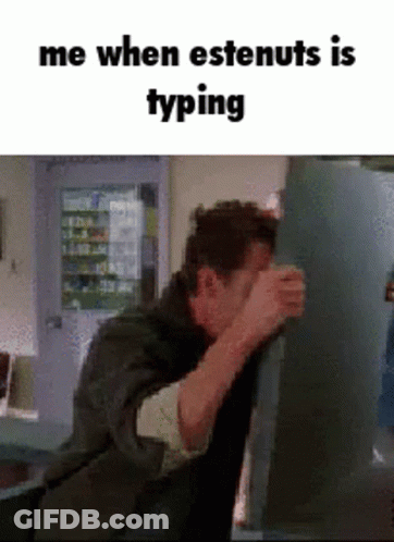 Man Covering Face While Typing On Computer GIF
