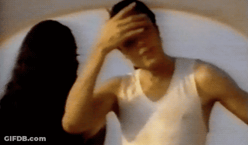 Man Covering Face While Woman Looks On GIF