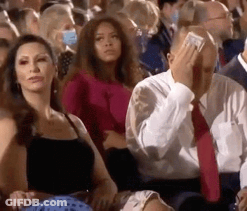 Man Covering Face With Dollar Bill GIF