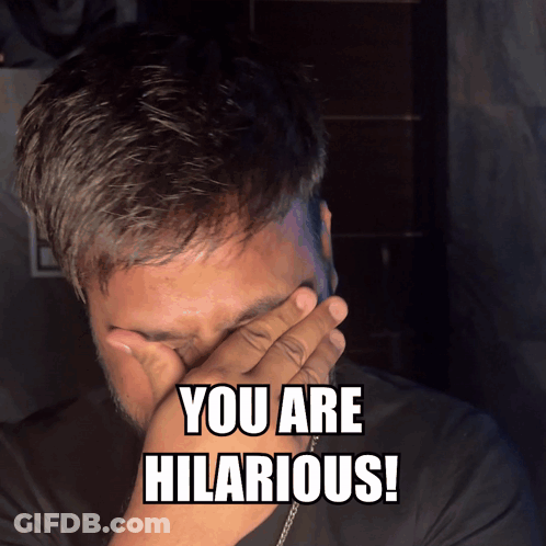 Man Covering Face With Hand Saying You Are Hilarious GIF