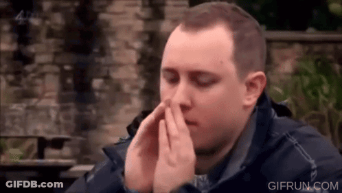 Man Covering Face With Hands At Table GIF