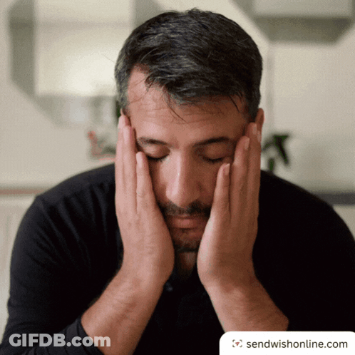 Man Covering Face With Hands GIF
