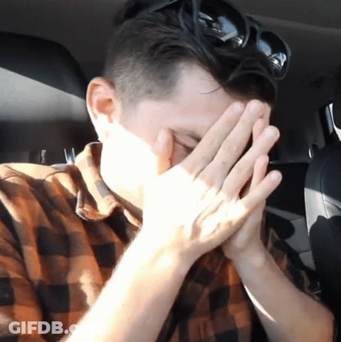 Man Covering Face With Hands In Car GIF