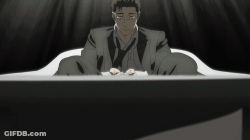 Man Covering Face With Hands In Dark Room GIF