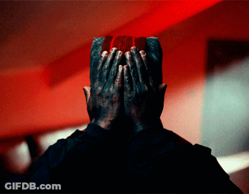 Man Covering Face With Hands Red Background GIF