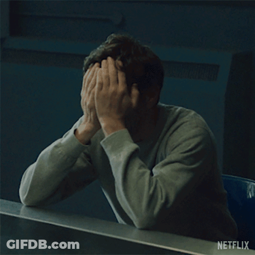 Man Covering Face With Netflix Logo GIF