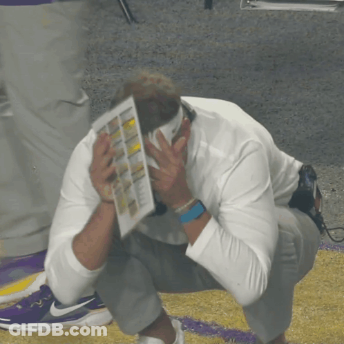 Man Covering Face With Paper And Nike Watch GIF