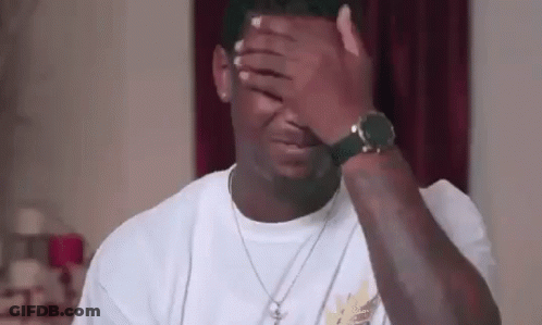 Man Covering Face With Watch And Necklace GIF