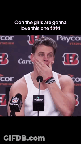 Man Covering Mouth At Microphone In Front Of Payco Sign GIF