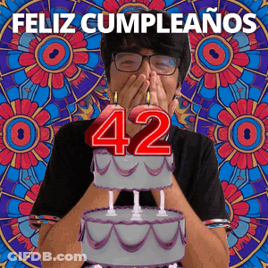 Man Covering Mouth In Front Of Birthday Cake With Number 42 GIF