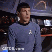 Man Covering Mouth In Front Of Orange Wall GIF