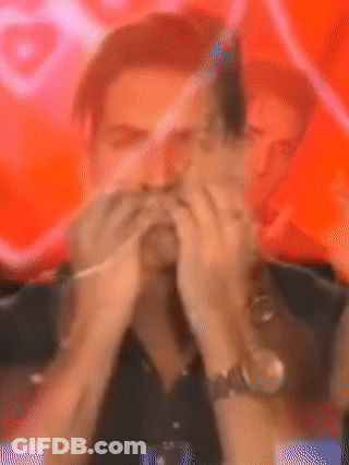 Man Covering Mouth In Front Of Red Background GIF