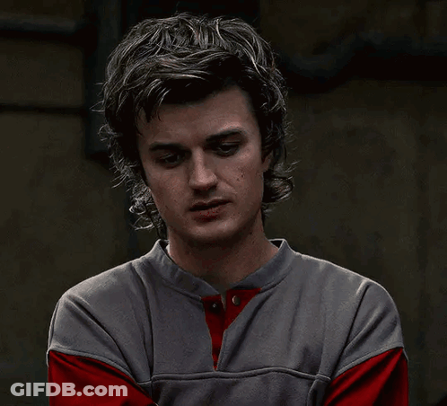 Man Covering Mouth In Gray And Red Shirt GIF