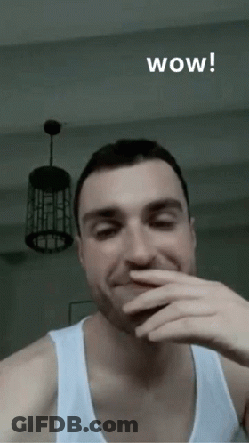 Man Covering Mouth Saying Wow GIF