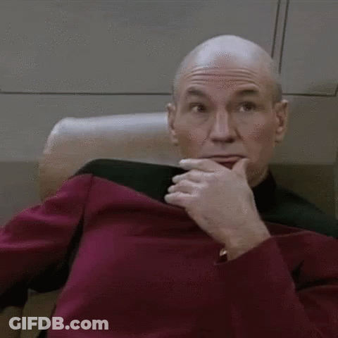 Man Covering Mouth While Sitting In Chair GIF