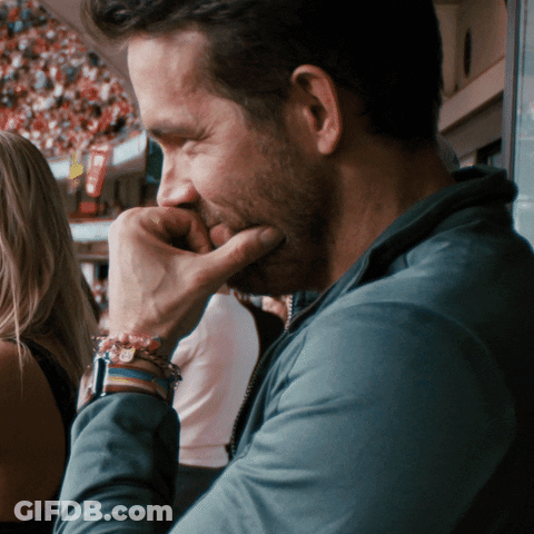 Man Covering Mouth With Hand And Bracelet GIF