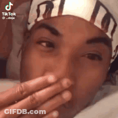 Man Covering Mouth With Headband GIF