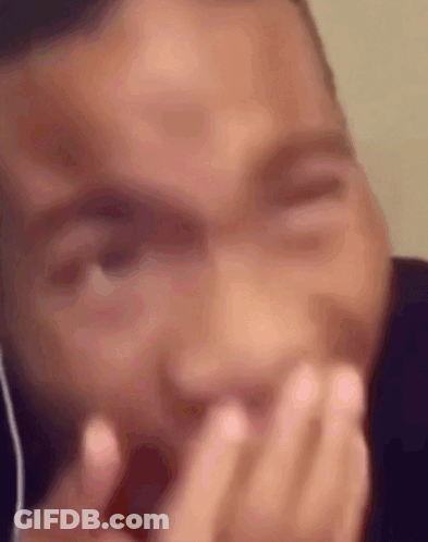 Man Covering Mouth With Headphones GIF
