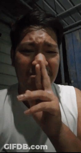 Man Covering Nose GIF
