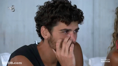 Man Covering Nose Watching Survivor GIF