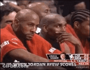 Man Covers Mouth At Basketball Game GIF
