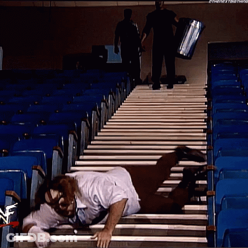Man Crawling Stairs Watched By Man With Box GIF