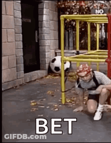 Man Crawling Under Ladder With Soccer Ball GIF