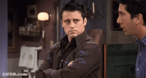 Man Crossed Arms Looking At Another GIF