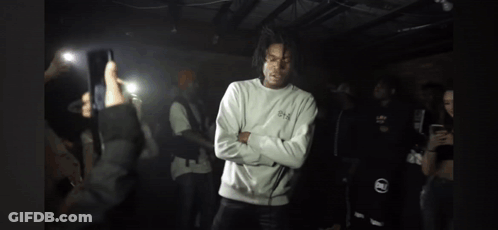 Man Crossed Arms Surrounded By People GIF