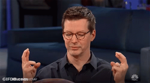 Man Crossed Fingers On Red Nose Day GIF