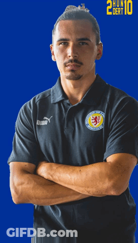 Man Crossing Arms In Black Puma Shirt GIF