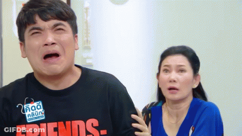 Man Crying Beside Surprised Woman GIF